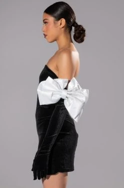 SHES FANCY MINI DRESS WITH GLOVE AND BOW ARM ACCENTS -AKIRA Shop shes fancy mini dress with glove and bow arm accents black white 4 4
