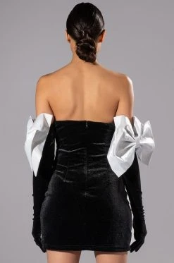 SHES FANCY MINI DRESS WITH GLOVE AND BOW ARM ACCENTS -AKIRA Shop shes fancy mini dress with glove and bow arm accents black white 5 5